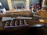 Cooper (Montana) model 52 Excalibur 6.5-284 with Swarovski and Ammo - 1 of 5