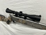 USED THOMPSON CENTER ENCORE 12 GA & 460 S&W STAINLESS CAMO LEUPOLD - 1 of 6