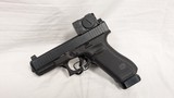 USED GLOCK 45 GEN. 5 W/ AIMPOINT ACRO 9MM - 1 of 2