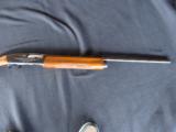 REMINGTON 1100, 16 GA. 26