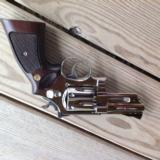 SMITH & WESSON 27-2, 357 MAG., RARE 3 1/2" BRITE NICKEL, UNFIRED NO TURN LINE, IN WOOD PRESENTATION 100% COND.[SOLD PENDING FUNDS]
- 3 of 4