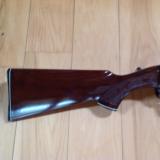 REMINGTON 1100, 12 GA. HIGH GLOSS WALNUT WITH WHITE DIAMOND IN PISTOL GRIP CAP, CHOICE OF 26" IC, VR. OR 28"
MOD., VENT RIB, 99%
COND. - 2 of 6