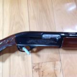 REMINGTON 1100, 12 GA. HIGH GLOSS WALNUT WITH WHITE DIAMOND IN PISTOL GRIP CAP, CHOICE OF 26" IC, VR. OR 28"
MOD., VENT RIB, 99%
COND. - 4 of 6