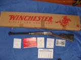 WINCHESTER 9422, 22 LR. "ONE OF 300"
SILVER RECEIVER, GRAY LAMINATE STOCK, NEW UNFIRED IN BOX [SOLD PENDING FUNDS] - 1 of 5