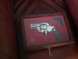 COLT PYTHON 357 MAG. 2 1/2" BRITE NICKEL, NEW UNTURNED, UNFIRED, 100% COND. IN COLT ETCHED IN GLASS DISPLAY CASE, CALIFORNIA LEGAL - 1 of 2