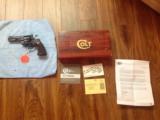 COLT PYTHON 357 MAGNUM, 4" BLUE, NEW UNFIRED, UNTURNED, 100% COND. IN BOX, MFG. 1975 [SOLD PENDING FUNDS] - 1 of 3