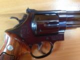 SMITH & WESSON 57 NO DASH, 41 MAG. 4" BLUE, APPEARS UNFIRED IN
WOOD S&W PRESENTATION BOX
- 7 of 9