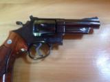 SMITH & WESSON 57 NO DASH, 41 MAG. 4" BLUE, APPEARS UNFIRED IN
WOOD S&W PRESENTATION BOX
- 9 of 9