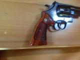SMITH & WESSON 57 NO DASH, 41 MAG. 4" BLUE, APPEARS UNFIRED IN
WOOD S&W PRESENTATION BOX
- 8 of 9