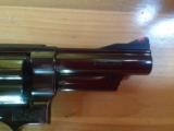 SMITH & WESSON 57 NO DASH, 41 MAG. 4" BLUE, APPEARS UNFIRED IN
WOOD S&W PRESENTATION BOX
- 6 of 9