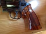 SMITH & WESSON 57 NO DASH, 41 MAG. 4" BLUE, APPEARS UNFIRED IN
WOOD S&W PRESENTATION BOX
- 5 of 9