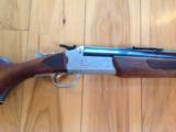 SAVAGE 24-J DELUXE 22 LR. OVER 410 GA. SATIN SILVER ENGRAVED RECEIVER WITH RED FOX ON LEFT & GROUSE IN FLIGHT ON RIGHT,WALNUT MONTE CARLO, GOOD COND.
- 2 of 7