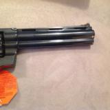 COLT PYTHON 357 MAG. 6" BLUE, LIKE NEW IN BOX WITH OWNERS MANUAL, HANG TAG, COLT LETTER, ETC.
- 4 of 6