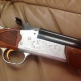 SAVAGE 24-J DELUXE 22 MAGNUM OVER 410 GA SATIN SILVER ENGRAVED RECEIVER WITH RED FOX ON LEFT & GROUSE IN FLIGHT ON RIGHT,WALNUT MONTE CARLO EXC. COND. - 3 of 7