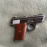 DAVIS 32 ACP. MODEL P-32, CHROME WITH FACTORY WOOD GRIPS - 1 of 2