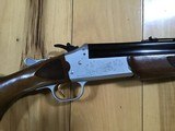SAVAGE 24 DELUXE, 22 LR. OVER 410 GA., SATIN SILVER ENGRAVED RECEIVER WITH RED FOX ON ONE SIDE AND GROUSE IN FLIGHT ON OTHER SIDE, EXC. COND. - 5 of 9