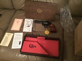 COLT DIAMONDBACK 22 LR., 4” BLUE, NEW UNFIRED, UNTURNED IN FACTORY COSMOLINE, MFG. 1969, IN THE ORIGINAL FACTORY BOX - 1 of 5