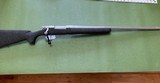 REMINGTON 700 7MM RUM CAL.,26” BARREL, 99+% COND. - 1 of 5
