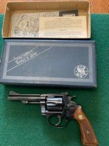 SMITH & WESSON 34 NO DASH, 22 LR., 4” BLUE, 99% COND. IN THE BOX WITH PAPERS - 1 of 7
