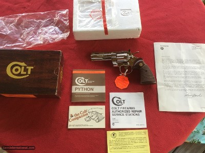 COLT PYTHON 357 MAGNUM, 4” BRIGHT NICKEL, MFG. 1982, NEW UNFIRED, UNTURNED, 100% COND. IN THE ORIGINAL BOX