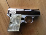 BROWNING BELGIUM “BABY” 25 AUTO, BRIGHT NICKEL, NEW COND. IN THE BROWNING RED LINED ZIPPER CASE WITH OWNERS MANUAL - 1 of 3