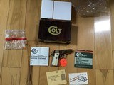 COLT GOVERNMENT 380 CAL., VERY HARD TO FIND BRIGHT NICKEL, FACTORY WHITE GRIPS, NEW UNFIRED IN THE BOX - 1 of 5