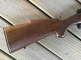 WINCHESTER 70 DELUXE 22-250 CAL., HAS JEWELED BOLT, HAS FANTASTIC FIDDLE FIGURE MONTE CARLO WALNUT WOOD, 99+% COND. IN THE BOX - 10 of 12