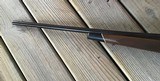 WINCHESTER 70 DELUXE 22-250 CAL., HAS JEWELED BOLT, HAS FANTASTIC FIDDLE FIGURE MONTE CARLO WALNUT WOOD, 99+% COND. IN THE BOX - 12 of 12