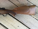 WINCHESTER 70 DELUXE 22-250 CAL., HAS JEWELED BOLT, HAS FANTASTIC FIDDLE FIGURE MONTE CARLO WALNUT WOOD, 99+% COND. IN THE BOX - 9 of 12