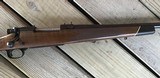 WINCHESTER 70 DELUXE 22-250 CAL., HAS JEWELED BOLT, HAS FANTASTIC FIDDLE FIGURE MONTE CARLO WALNUT WOOD, 99+% COND. IN THE BOX - 11 of 12