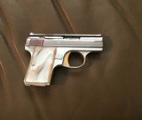 BROWNING BELGIUM BABY 25 AUTO RARE BRIGHT NICKEL, GOLD TRIGGER, PEARLITE GRIPS, NEW 100% COND., UNFIRED IN THE BOX WITH OWNERS MANUAL - 3 of 4
