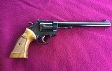 SMITH & WESSON 17-4, 22 LR. 8 3/8” BLUE, LOOKS BRAND NEW IN THE BOX WITH OWNERS MANUAL & CLEANING TOOLS IN PLASTIC & OIL PAPER - 3 of 10