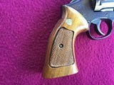 SMITH & WESSON 17-4, 22 LR. 8 3/8” BLUE, LOOKS BRAND NEW IN THE BOX WITH OWNERS MANUAL & CLEANING TOOLS IN PLASTIC & OIL PAPER - 8 of 10