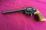 SMITH & WESSON 17-4, 22 LR. 8 3/8” BLUE, LOOKS BRAND NEW IN THE BOX WITH OWNERS MANUAL & CLEANING TOOLS IN PLASTIC & OIL PAPER - 2 of 10