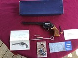 SMITH & WESSON 17-4, 22 LR. 8 3/8” BLUE, LOOKS BRAND NEW IN THE BOX WITH OWNERS MANUAL & CLEANING TOOLS IN PLASTIC & OIL PAPER - 1 of 10