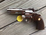 COLT PYTHON 357 MAGNUM, 4” BRIGHT NICKEL, MFG. 1968, NEW UNFIRED IN THE BOX WITH OWNERS MANUAL, HANG TAG, ETC. - 2 of 5