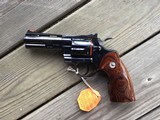 COLT PYTHON 357 MAGNUM
“ELITE” 4” ROYAL BLUE, NEW IN THE BOX WITH OWNERS MANUAL, HANG TAG, COLT LETTER, ETC. - 7 of 10