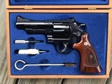 SMITH & WESSON 57-3, 41 MAGNUM, RARE 4” BLUE, TARGET TRIGGER, TARGET HAMMER, TARGET GRIPS, NEW IN WOOD PRESENTATION CASE WITH CLEANING TOOLS - 1 of 4