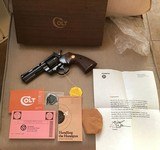 COLT PYTHON 357 MAGNUM, 4” BLUE, MFG. 1973, NEW UNFIRED IN THE BOX WITH OWNERS MANUAL, HANG TAG, COLT SCREWDRIVER,COLT LETTER, ETC.