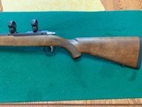 RUGER 77, 17 HMR CAL. 22” BARREL, WALNUT STOCK, BLUE RECEIVER, COMES WITH RINGS, 99+% COND.