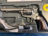 -RUGER VAQUERO 45 COLT, NEW MODEL, BRIGHT STAINLESS, 5 1/2”
BARREL, LIKE NEW IN THE BOX WITH OWNERS MANUAL - 2 of 6