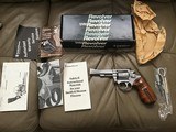 SMITH & WESSON 651, 22 MAGNUM, 4” STAINLESS, “LEW HORTON” WITH BEAUTIFUL WALNUT FINGER GROOVE GRIPS, NEW UNFIRED IN THE BOX - 1 of 7