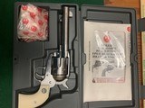 RUGER VAQUERO 45 COLT, GLOSS STAINLESS, 5 1/2” BARREL, HIGH COND. IN THE BOX WITH OWNERS MANUAL