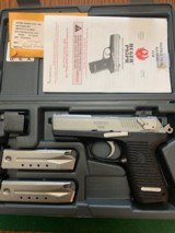 RUGER 96, 9 MM, STAINLESS, LIKE NEW IN THE BOX WITH OWNERS MANUAL & MAG’S - 1 of 4