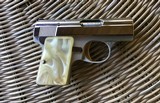 BROWNING BELGIUM “BABY” 25 AUTO, LIGHTWEIGHT ALUMINUM FRAME, BRIGHT NICKEL, GOLD TRIGGER, PEARLITE GRIPS, NEW UNFIRED IN BROWNING ZIPPER POUCH - 3 of 5