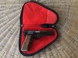 SOLD———-BROWNING BELGIUM HIGH POWER 9 MM, MFG. 1970, RING HAMMER, COMES WITH BROWNING ZIPPER CASE WITH RED INTERIOR ALL IN HIGH
CO ND. - 1 of 4