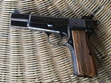 SOLD———-BROWNING BELGIUM HIGH POWER 9 MM, MFG. 1970, RING HAMMER, COMES WITH BROWNING ZIPPER CASE WITH RED INTERIOR ALL IN HIGHCO ND. - 3 of 4