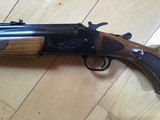 SAVAGE 24 DELUXE, 22 LR. OVER 410 GA., BLUE ENGRAVED RECEIVER WITH GROUSE IN FLIGHT, ON
ONE SIDE, RED FOX ON THE OTHER SIDE, GOLD TRIGGER, LIKE NEW - 6 of 9