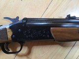 SAVAGE 24 DELUXE, 22 LR. OVER 410 GA., BLUE ENGRAVED RECEIVER WITH GROUSE IN FLIGHT, ON
ONE SIDE, RED FOX ON THE OTHER SIDE, GOLD TRIGGER, LIKE NEW - 7 of 9