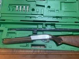 REMINGTON 1100 PREMIER SPORTING 12 GA., NICKEL RECEIVER, 28” PORTED BARREL, 4 EXTENDED CHOKE TUBES, LIKE NEW IN THE CASE - 1 of 5
